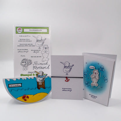 Beispiel-Grußkarten im Vordergrund, gestaltet mit dem Stanzi® Bastelset – Case im Hintergrund sichtbar